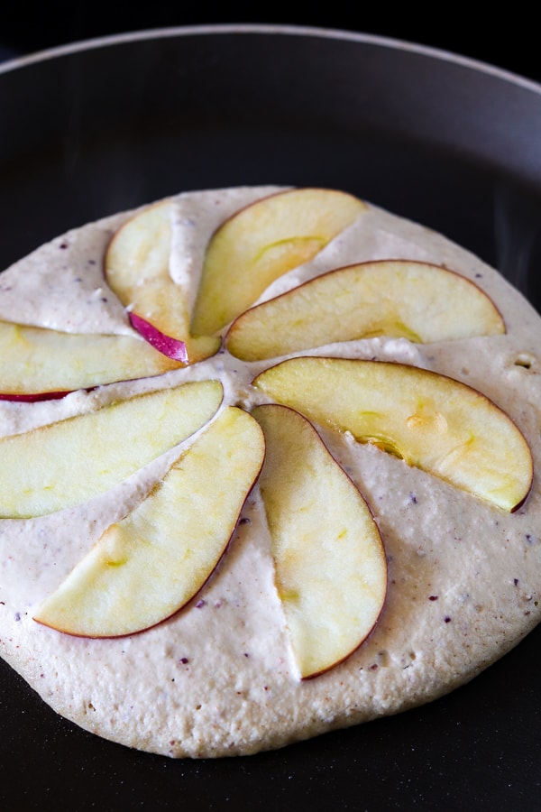 Cooking vegan chickpea pancakes with apples