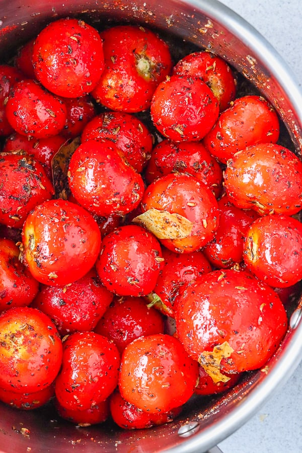 Frying tomatoes in herbs & garlic