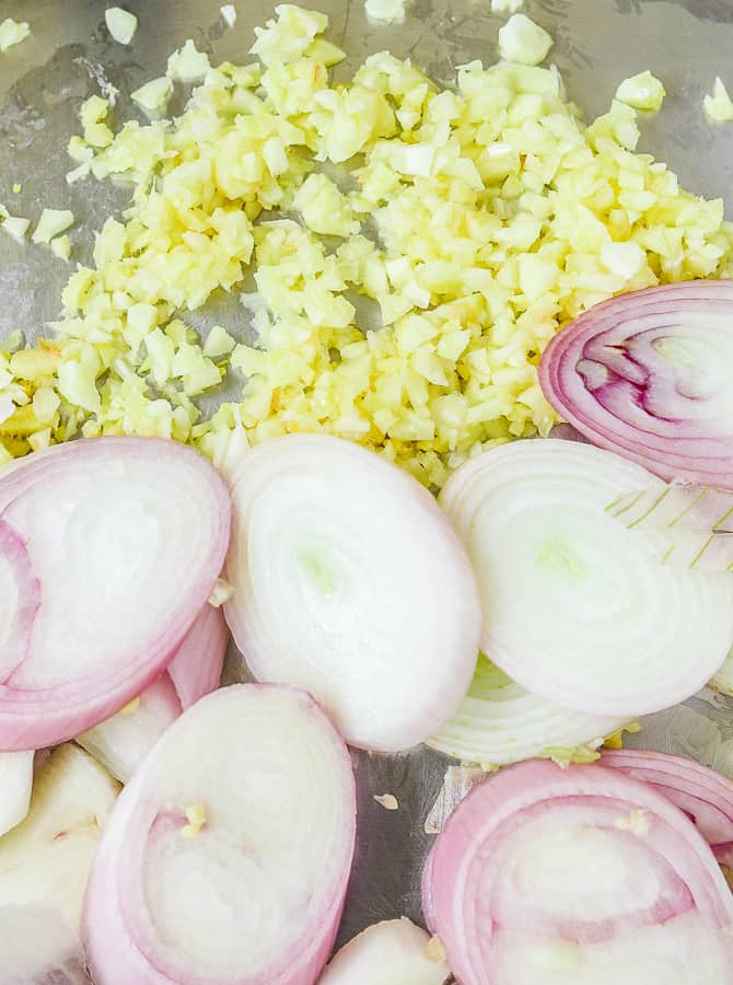 Diced & sliced garlic, ginger & shallots in a pan
