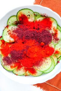 spices on sliced cucumbers