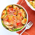 Spicy marinated cucumber salad in a small bowl