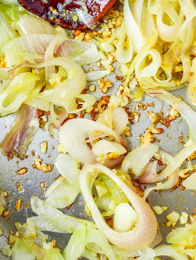stir-frying garlic, ginger, and shallots