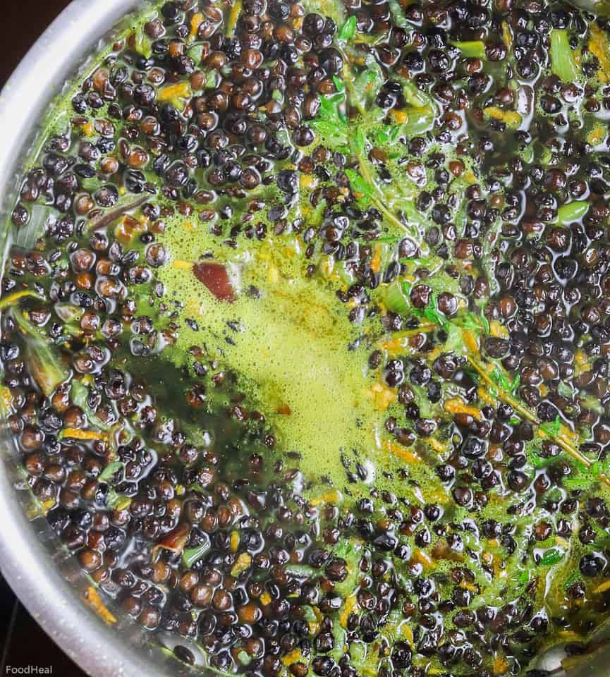 Cooking beluga lentils in vegetable broth