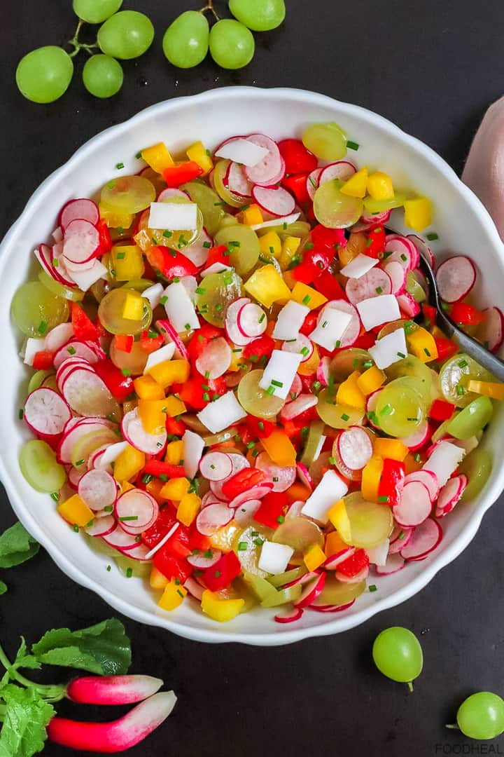 Radishes, belle peppers, coconut and grapes salad