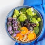 purple potato, broccoli, carrots, and prunes bwl