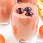 Protein-rich vegan smoothie topped with frozen cherries