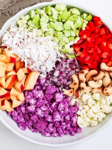 chopped ingredients of 3 cauliflower salad in a bowl