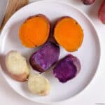 Orange, white & purple cooked sweet potatoes cut in pieces